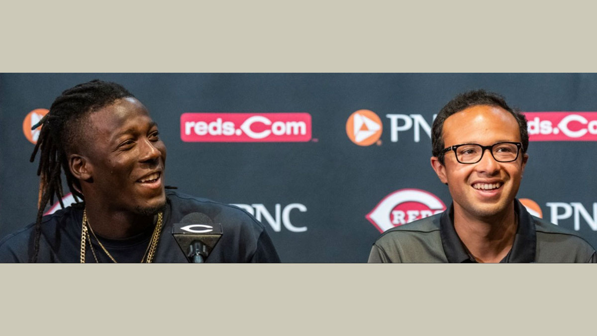 Jorge Merlos pictured interpreting for Reds player Elly De La Cruz.