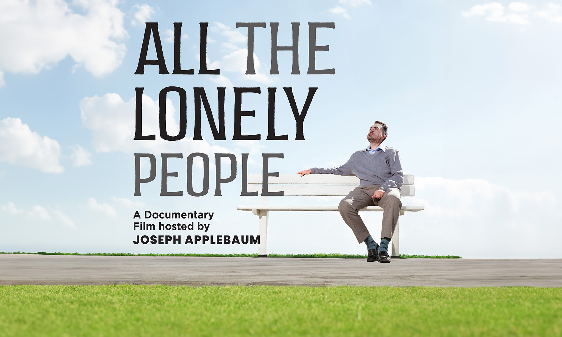 A man sitting on a bench outside