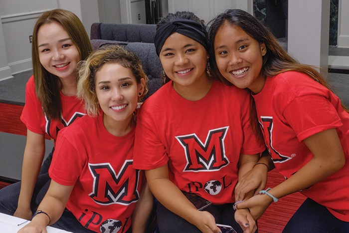 A group of orientation leaders wearing Miami shirts and ready to help new international students